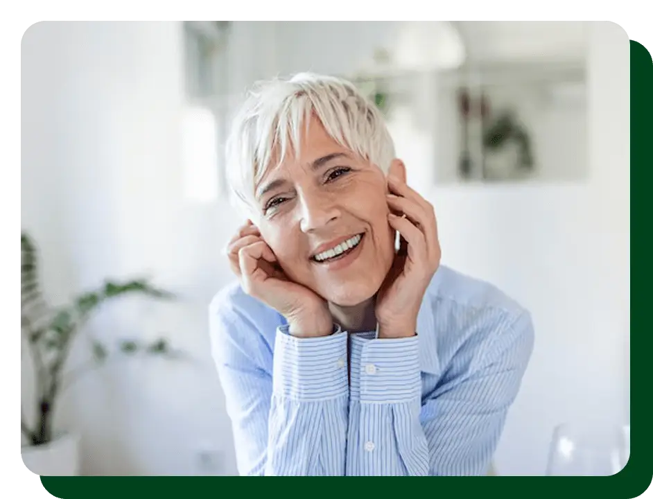 Woman smiling with healthy teeth after using Oradentum dental supplement
